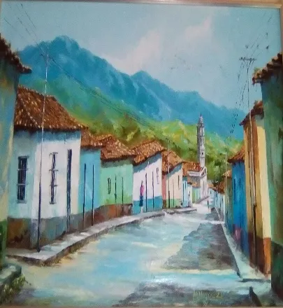 Óleo de una calle de Timotes con las casas de colores, los techos de teja y la torre de la Basílica al fondo del cañón de la calle.